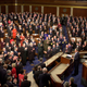 Both sides stand for the end of George W. Bush’s speech in January of 2002.